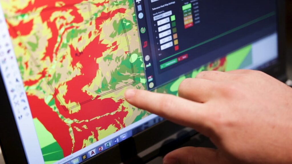 Person pointing the heatmap on screen.